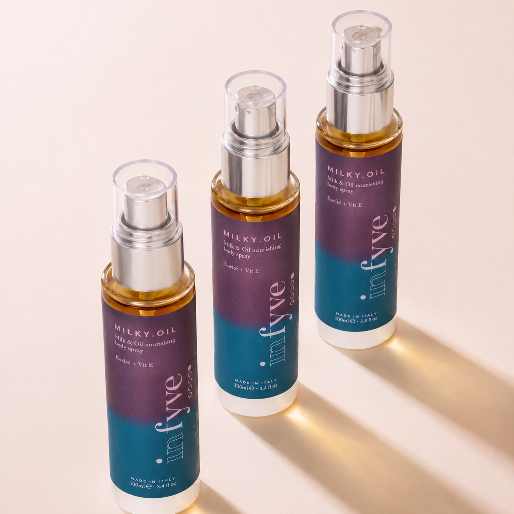 Tre flaconi MILKY.OIL Nourishing Body Spray INFYVE Beauty con luce naturale – Made in Italy